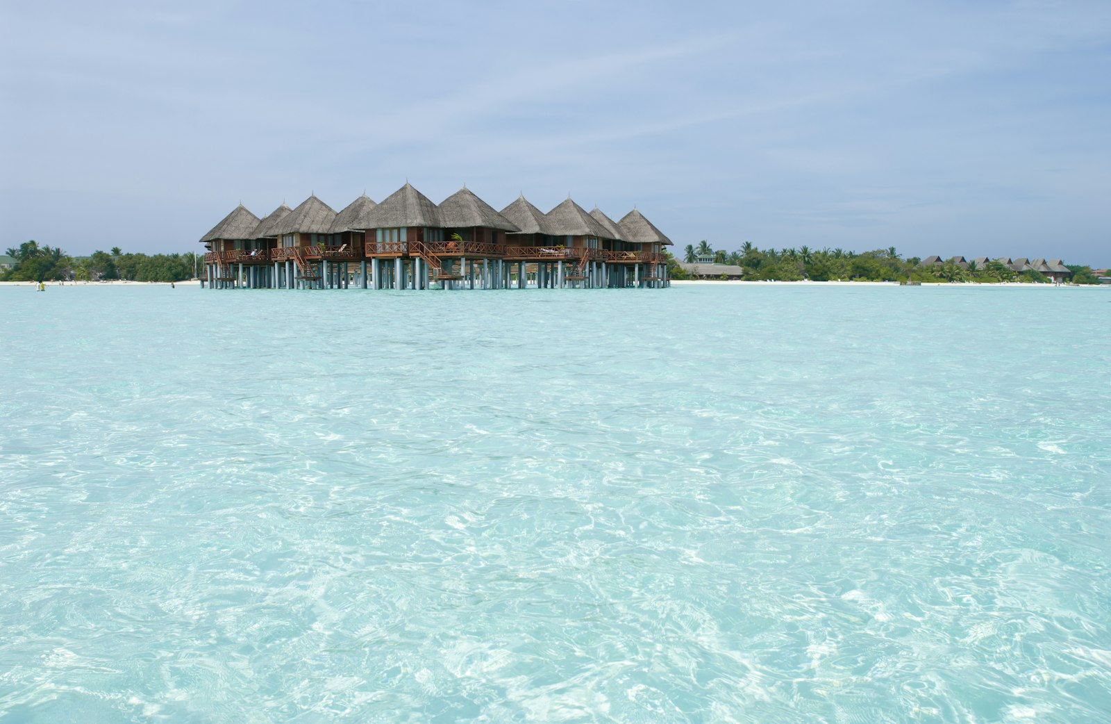 Shingled cottage on stilts overlooking the water